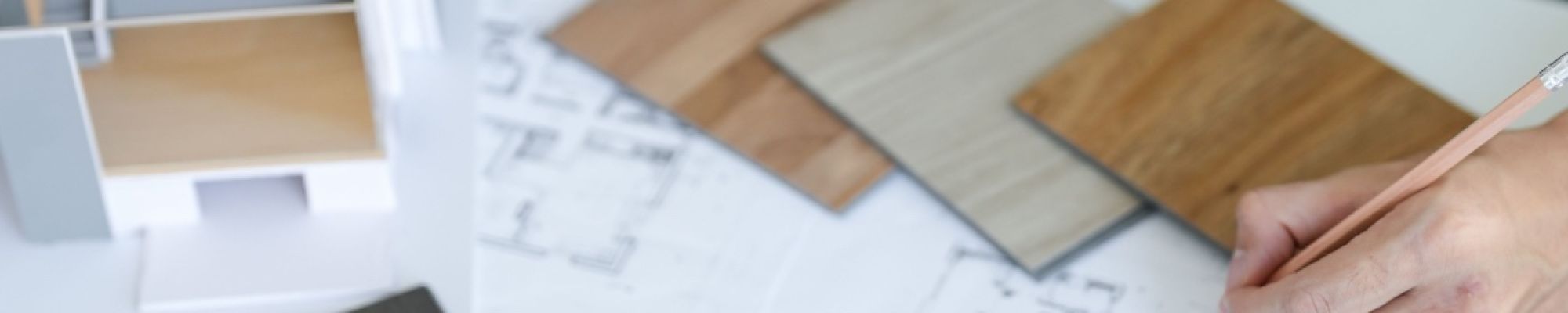 A Houston custom home builder designing the blueprints of a house