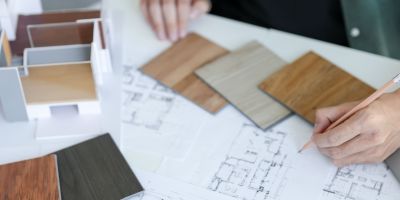 A Houston custom home builder designing the blueprints of a house